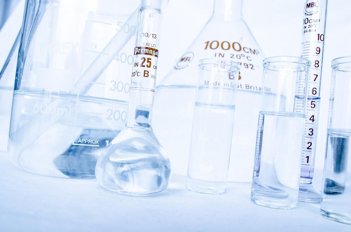 Close up of laboratory glassware and scientific equipment for cosmetic testing.
